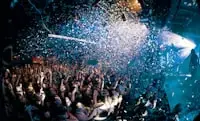 Inspiration: crowded wedding dance floor under confetti and blue stage lighting